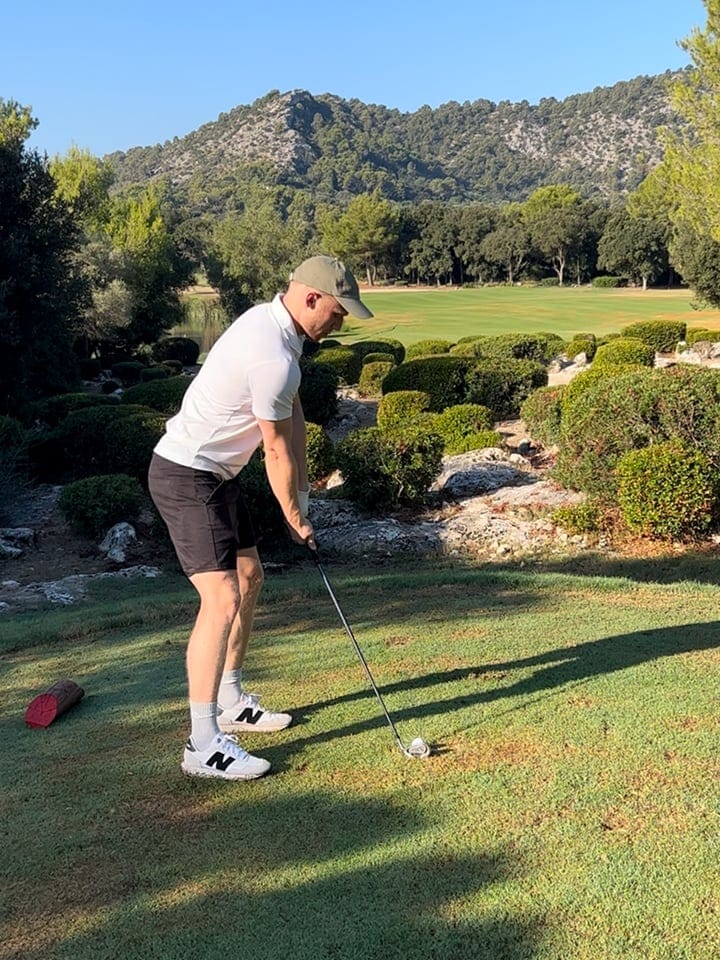 Josh playing golf in Spain.